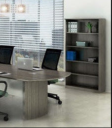 Modern conference room with a table, chairs, and bookcase.