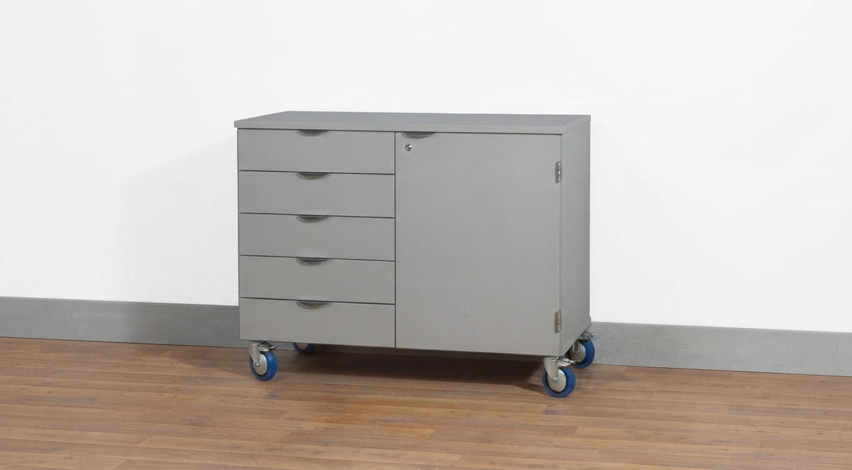 A mobile wood rolling storage cabinet with five drawers on the left and a single door on the right, mounted on caster wheels