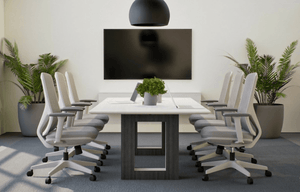 Modern 8ft conference table with open-frame pedestal bases in a boardroom