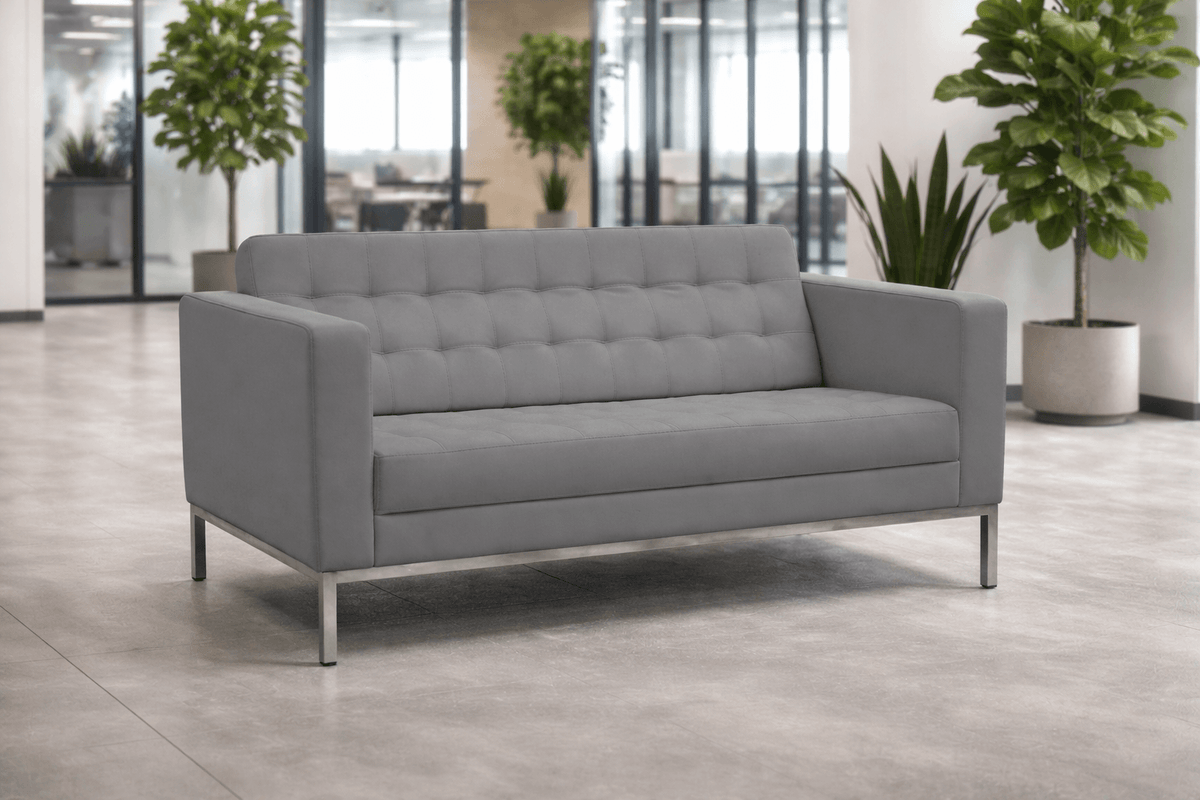 Gray tufted modern sofa with clean lines and metal legs
