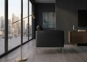 Black modern sofa from a side view, featuring a tufted back, clean lines, and slim metal legs
